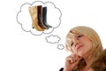 Beauty woman thinking on new boots Royalty Free Stock Photo