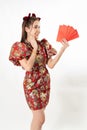 Beauty woman wear cheongsam and take Red envelopes in chinese new year Royalty Free Stock Photo