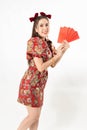 Beauty woman wear cheongsam and take Red envelopes in chinese new year Royalty Free Stock Photo