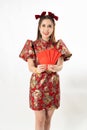 Beauty woman wear cheongsam and take Red envelopes in chinese new year Royalty Free Stock Photo