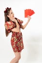 Beauty woman wear cheongsam and take Red envelopes in chinese new year Royalty Free Stock Photo