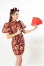 Beauty woman wear cheongsam and take Red envelopes in chinese new year Royalty Free Stock Photo