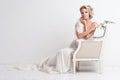 Beauty woman with wedding hairstyle and makeup. Bride fashion. Jewelry and Beauty. Woman in white dress,perfect skin, blond hair. Royalty Free Stock Photo