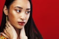 Beauty young asian girl with fashion make up on red background , beauty stylish look