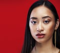 Beauty young asian girl with fashion make up on red background , beauty stylish look