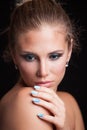 Beauty young blonde woman portrait blue eyes hair in bun