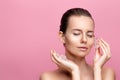 Beauty caucasian woman with healthy clean fresh skin applies Ice cubes on face. Skincare concept Royalty Free Stock Photo