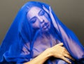 Beauty young islamic woman under veil, blue hijab on face close up, art terrorism Royalty Free Stock Photo