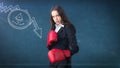 Beauty young business woman standing near sketches of Ethereum crypto currency coin. Business concept of Ethereum icon. Royalty Free Stock Photo