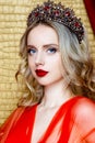 Beauty young queen long blond hair crown on her head close up and red lips Royalty Free Stock Photo