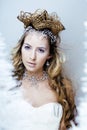 beauty young snow queen with hair crown on her head, complicate hairstyle, winter concept Royalty Free Stock Photo