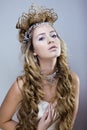 Beauty young snow queen with hair crown on her head, complicate hairstyle, winter concept Royalty Free Stock Photo