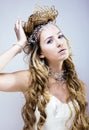 Beauty young snow queen with hair crown on her head, complicate Royalty Free Stock Photo