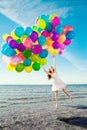 Beauty young stylish woman with multi-colored rainbow balloons i Royalty Free Stock Photo