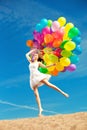 Beauty young stylish woman with multi-colored rainbow balloons i Royalty Free Stock Photo