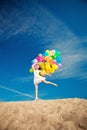 Beauty young stylish woman with multi-colored rainbow balloons i Royalty Free Stock Photo