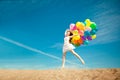 Beauty young stylish woman with multi-colored rainbow balloons i Royalty Free Stock Photo