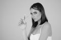 Beauty young woman cutting hair with scissors isolated on studio background. Beautiful girl about to cut hair. Hair cut Royalty Free Stock Photo