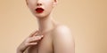 Beauty young woman portrait  on Beige. Beautiful model girl with beauty makeup, red lips, perfect Royalty Free Stock Photo