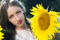 Beauty young woman in sunflower field Royalty Free Stock Photo