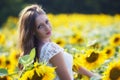 Beauty young woman in sunflower field Royalty Free Stock Photo