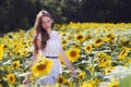 Beauty young woman in sunflower field Royalty Free Stock Photo