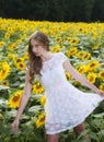 Beauty young woman in sunflower field Royalty Free Stock Photo