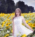 Beauty young woman in sunflower field Royalty Free Stock Photo