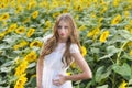 Beauty young woman in sunflower field Royalty Free Stock Photo