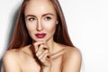 Beauty young Woman on white. Beautiful Model Girl with Makeup, Red Lips, Perfect Fresh Skin. Flirting Expressive Face Royalty Free Stock Photo