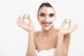 Beauty Youth Skin Care Concept - Portrait Beautiful Caucasian Woman apply cream and holding fresh cucumber in front of