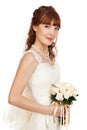 A beautyful bride holding her bouquet from roses and smiling. I Royalty Free Stock Photo