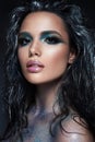 Beautyful girl with blue glitter on her face Royalty Free Stock Photo