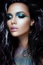 Beautyful girl with blue glitter on her face Royalty Free Stock Photo