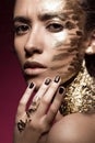 Beautyful girl with gold glitter on her face. Art image beauty Royalty Free Stock Photo