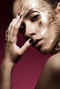 Beautyful girl with gold glitter on her face. Art image beauty Royalty Free Stock Photo