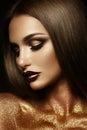 Beautyful girl with gold glitter on her face Royalty Free Stock Photo