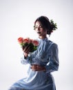 The beautyful lady with flower hair clip on her head,holding rose bouquet in hand, Royalty Free Stock Photo