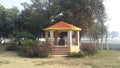 Beautyful park stage home with in a stachu of powerful man of country lndia arounding in trees