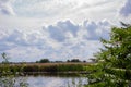 Beautyful view of river reeds and cloudy sky. Latvian summer in august .beautiful cloudy sky Royalty Free Stock Photo