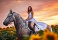 Beautyful woman with horse on nature