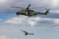 BEAUVECHAIN, BELGIUM - MAY 20, 2015: Belgian army NH90 helicopter transporting an artillery piece