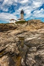 Beavertail Lighthouse Over Unique Rock Formation Royalty Free Stock Photo