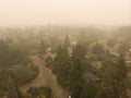 Beaverton Oregon city in smoke, behind burning forests, top view, news