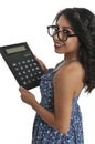 Woman using oversized calculator Royalty Free Stock Photo