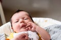 Bebe with yellow and white body lying on baby hammock Royalty Free Stock Photo