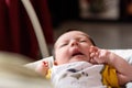 Bebe with yellow and white body lying on baby hammock Royalty Free Stock Photo