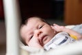 Bebe with yellow and white body lying on baby hammock Royalty Free Stock Photo