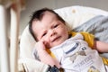 Bebe with yellow and white body lying on baby hammock Royalty Free Stock Photo