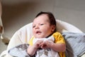 Bebe with yellow and white body lying on baby hammock Royalty Free Stock Photo